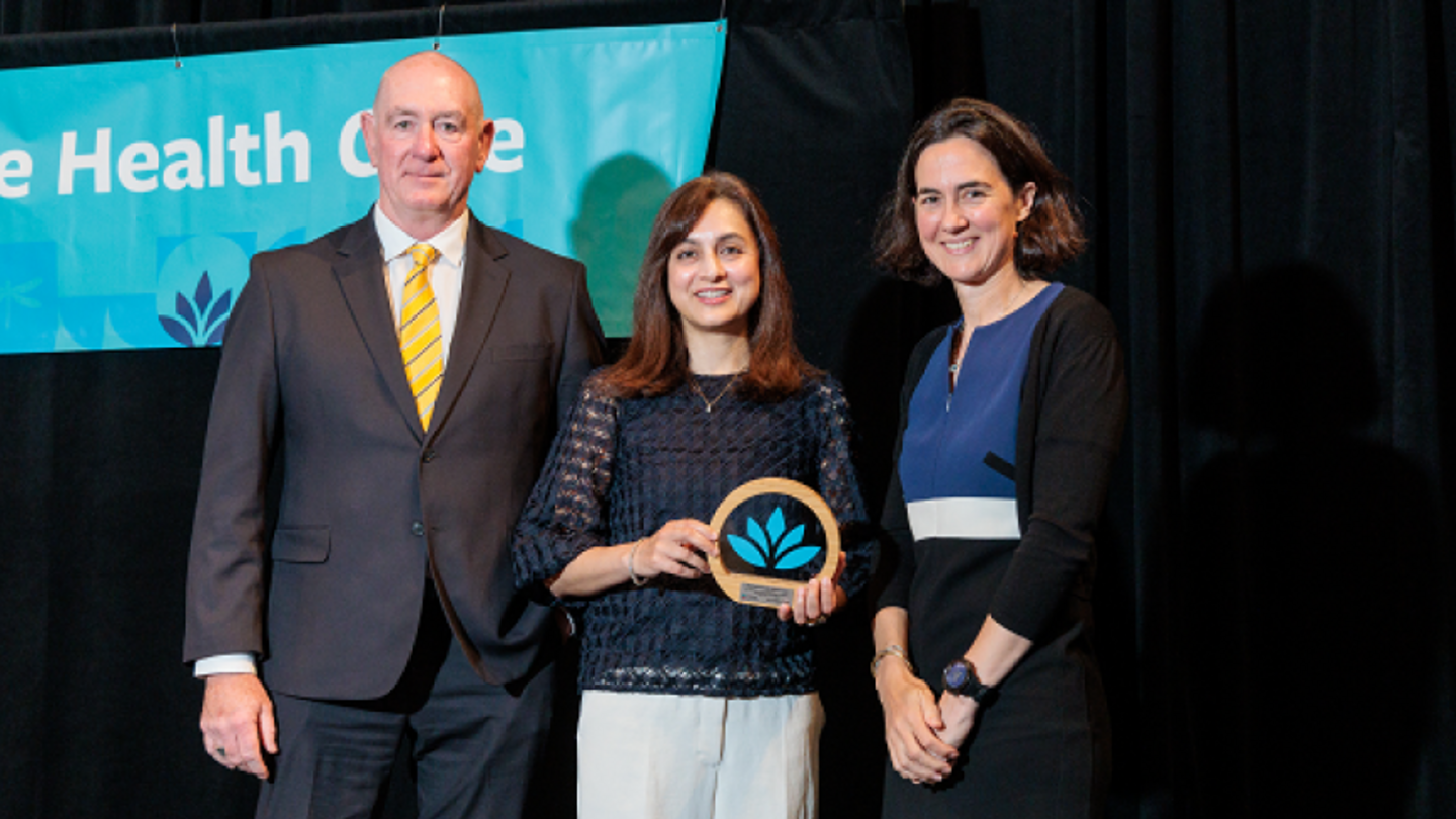 Dr. Nadia Khan, centre, receives the 2024 Research and Mission Award.